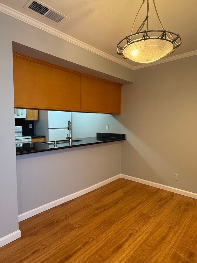 Building Photo - Spacious 2 Bedroom 1 Bath Condo with private patio and storage