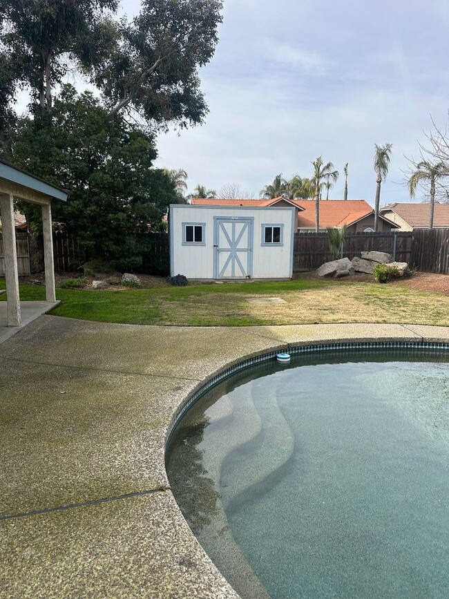 Building Photo - Spacious 4-Bedroom Rental with Pool & Hot ...