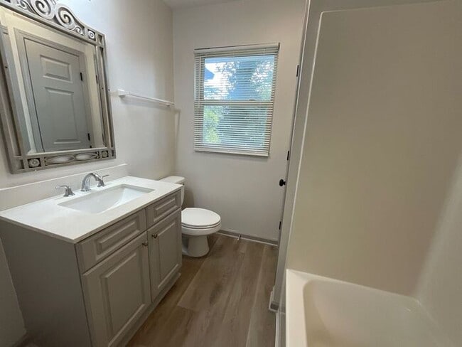 Building Photo - **Spacious 4BR with Modern Upgrades & Cove...