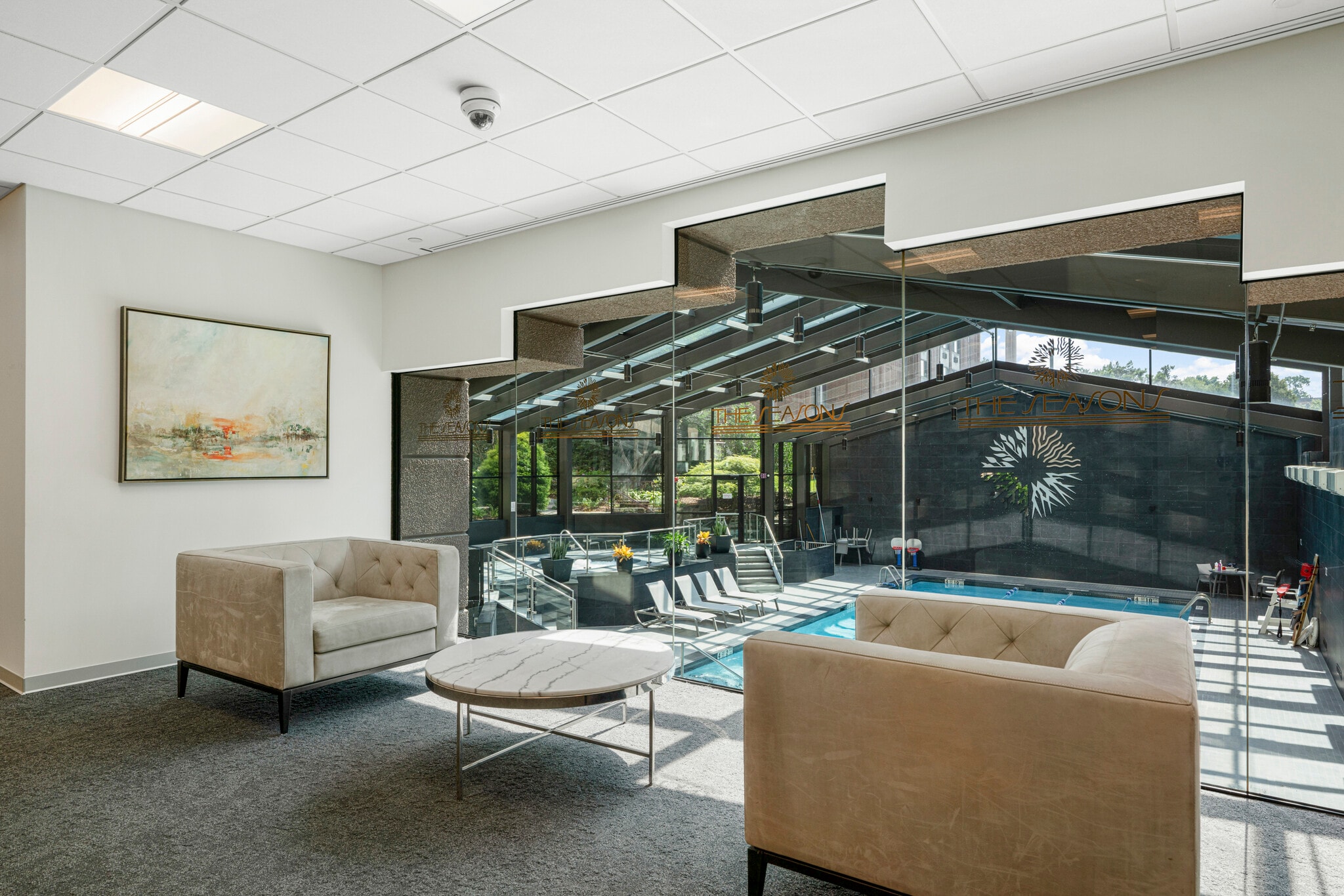 Light-filled conversation areas throughout lobby overlook indoor pool and spa. - 4 Martine Ave