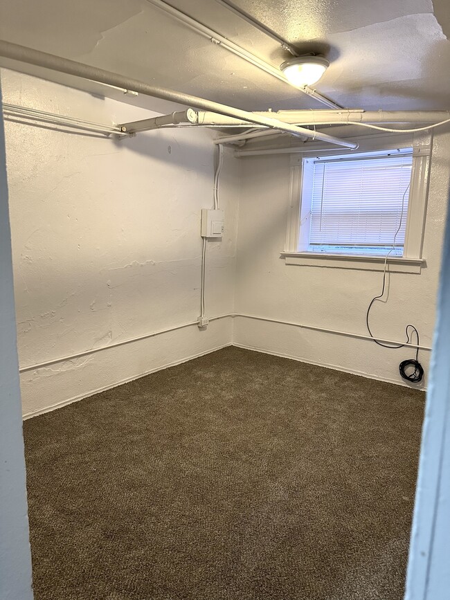 Discover this versatile basement room, perfect for creating a comfortable living space. - 1458 N Gaylord St