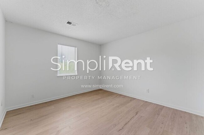 Building Photo - Updated Home with Spacious Layout & Private Backyard