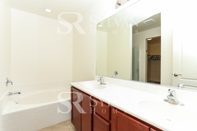 Building Photo - The living is easy in this 5 bedroom, 3 ba...