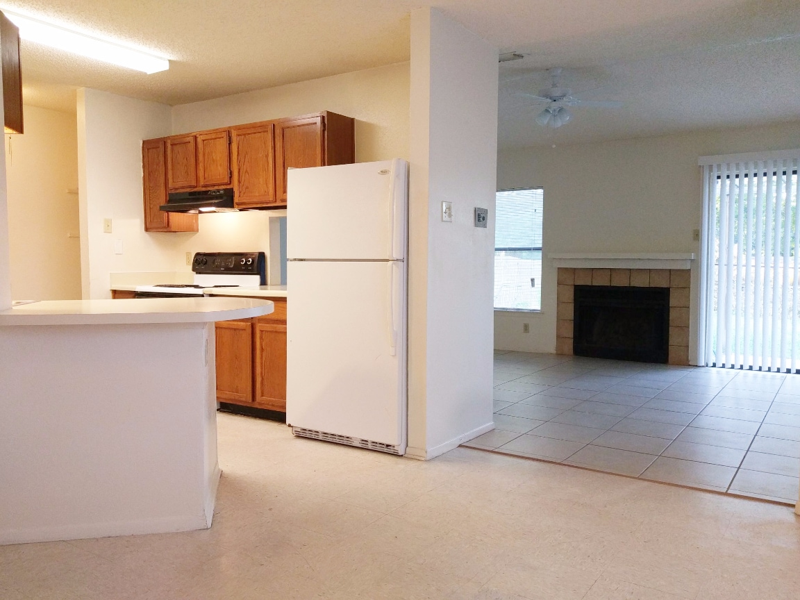 Kitchen to Living Room with a Kitchen Pass-Through/Breakfast Bar - 2521 Corian Glen Dr