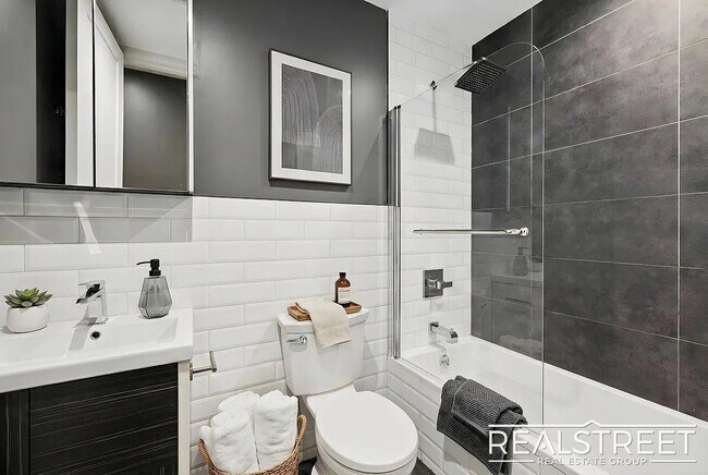 Building Photo - Modern Bushwick 2-bedroom, 2.5-bath duplex with private garden, deck, and finished recreation room —