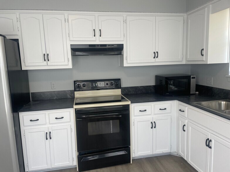 Newly painted cabinets and new countertops - 17419 E 42nd St S