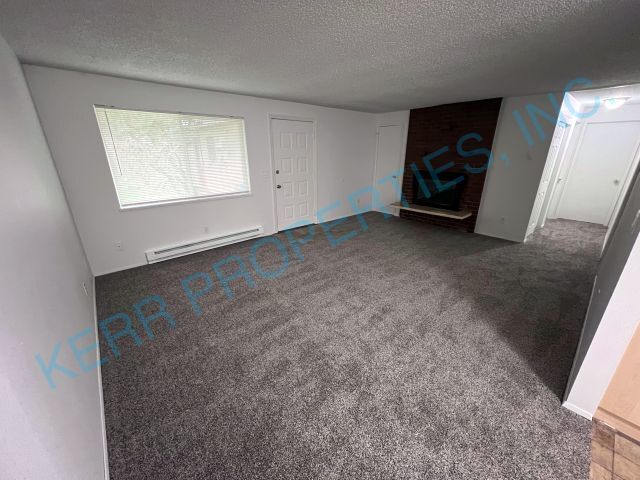 Building Photo - Cozy 2-Bedroom Duplex with Fireplace Charm...