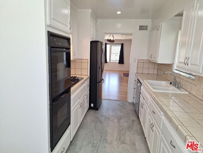 Building Photo - 6446 Riggs Pl