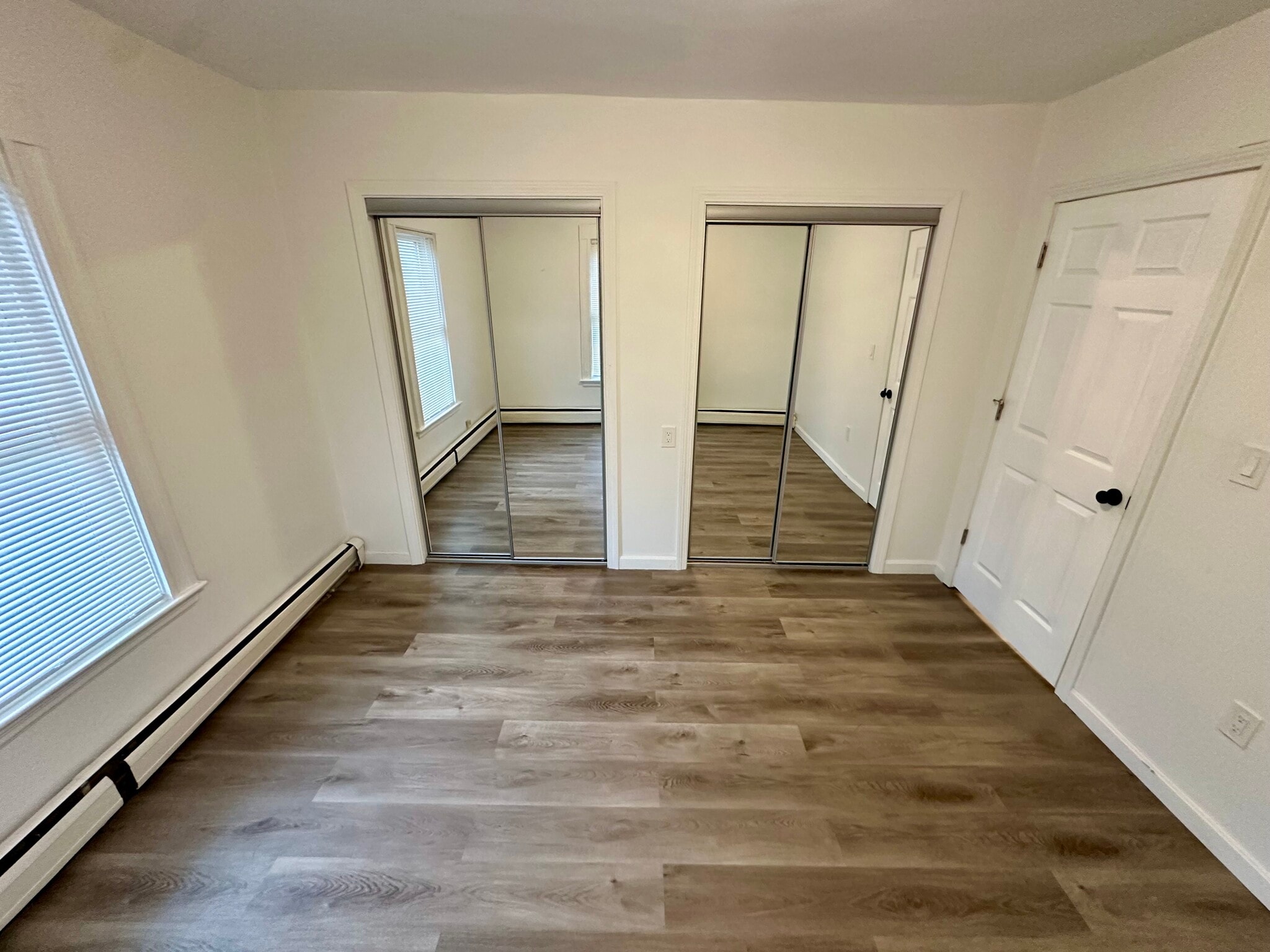Full closet with twin mirror sliding doors. - 8 Avon St