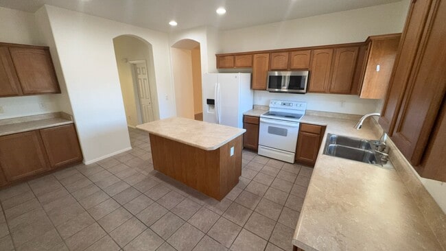 Building Photo - Stylish 3BR Oasis: Open Layout, Gourmet Kitchen, Master Retreat, and Serene Patio! Your Dream Hom...