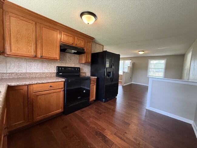 Building Photo - Will consider Section 8 "Charming 4-Bedroom Home with Hardwood Floors on Ready Section Road!"