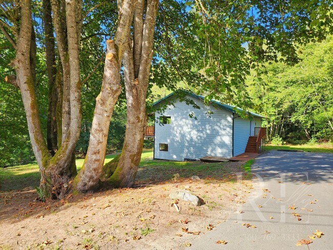 Building Photo - Vaulted Ceilings, Unique Designer Kitchen & Expansive Half-Acre Setting with Flexible Living Spaces