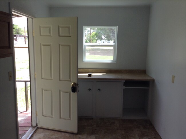 Large laundry / mud room off the back deck. Great place to fold laundry and for storage. Washer and Dryer are to the left next to the door. - 24 N K St