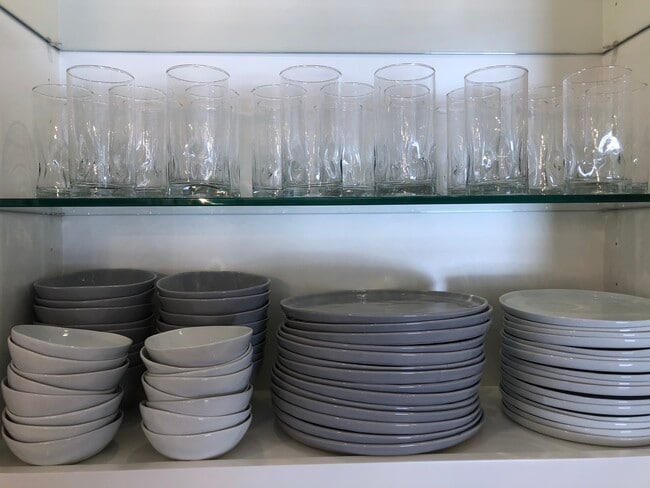 Service for 8 from Crate and Barrel with many coordinating different-size pieces and serve ware. - 8437 N 84th St