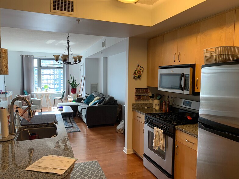 Kitchen with granite countertops and a gas stove. - 475 K Street Northwest