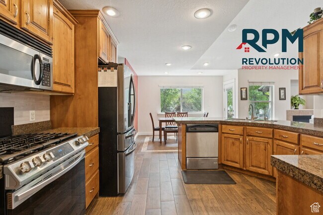 Building Photo - "Spacious 6-Bed Gem with Granite Touches & Cozy Fireplace in Morgan!"