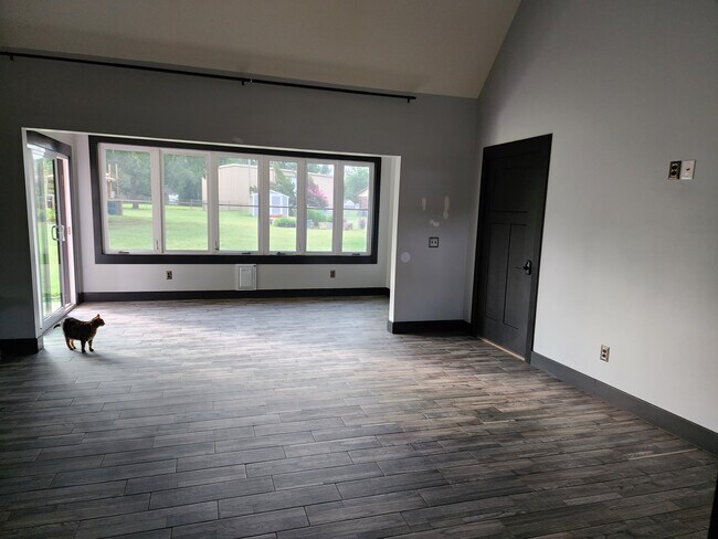 Sunroom with covered private patio to left screened in porch to the right - 16271 E 82nd St N