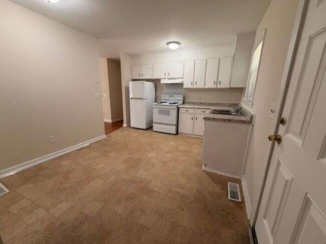 Building Photo - Three bedroom brick home available now!