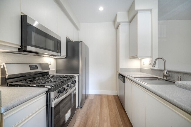 Building Photo - Coastal Living at Its Best – Upgraded 1BR Condo with Private Patio & Resort-Style Amenities