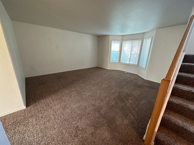 Building Photo - Spacious 2 bed/2.5 bath with bonus room townhome off Road 68