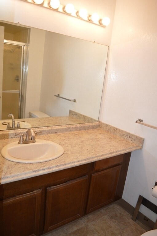Building Photo - Spacious and Conveniently Located with Private Patio and Parking