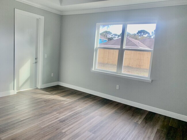 Building Photo - "Spacious 4-Bedroom 3-Bath with In-Law Suite & Granite Finishes in Palm Bay!"