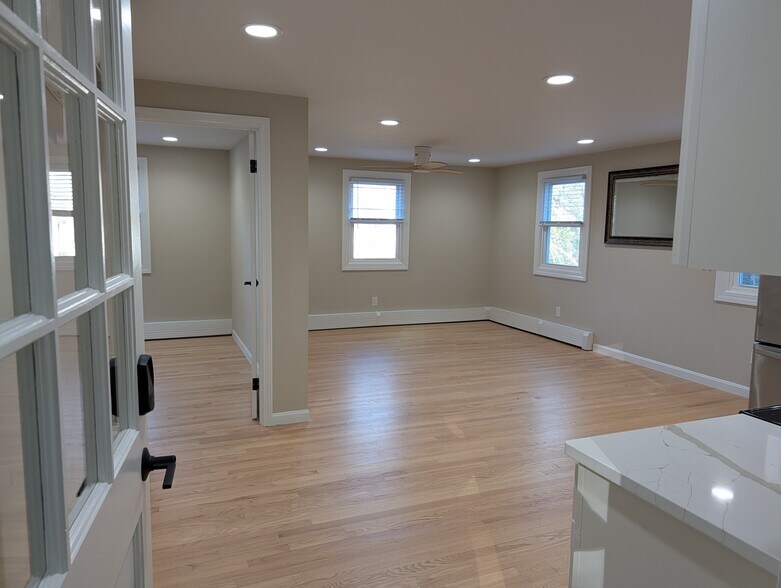 Living area door to bedroom on left - 63 Buttles Rd