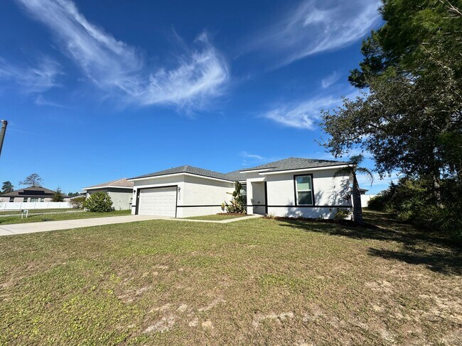 Building Photo - $500 OFF OF A MONTH OF RENT! Beautiful 4BD/2BA Home in Poinciana – No HOA Approval Needed! Pets W...