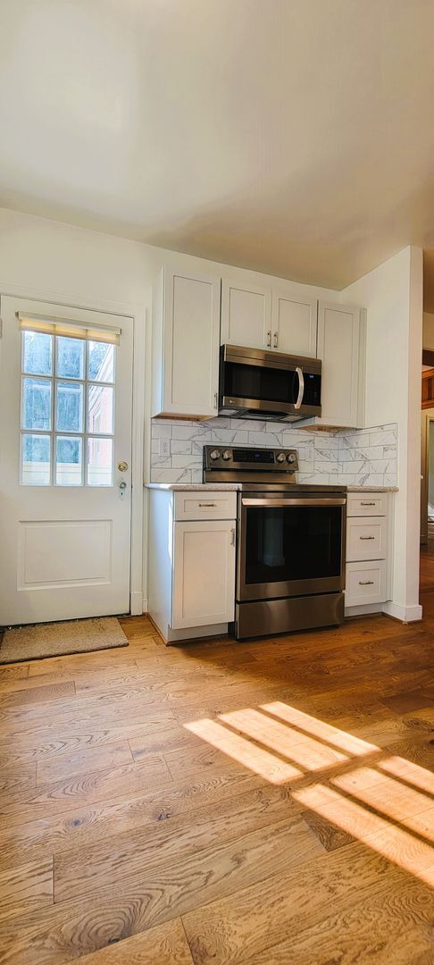 Building Photo - Remodeled brick bungalow with 1st floor li...