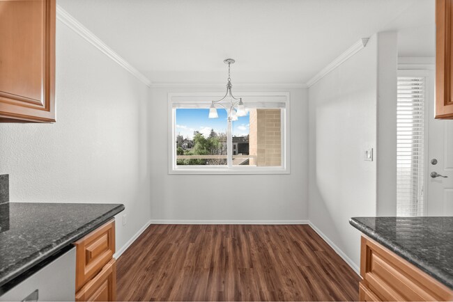 Experience the warmth of this sunlit dining area, perfect for intimate gatherings. - Vista Terrace Apartments