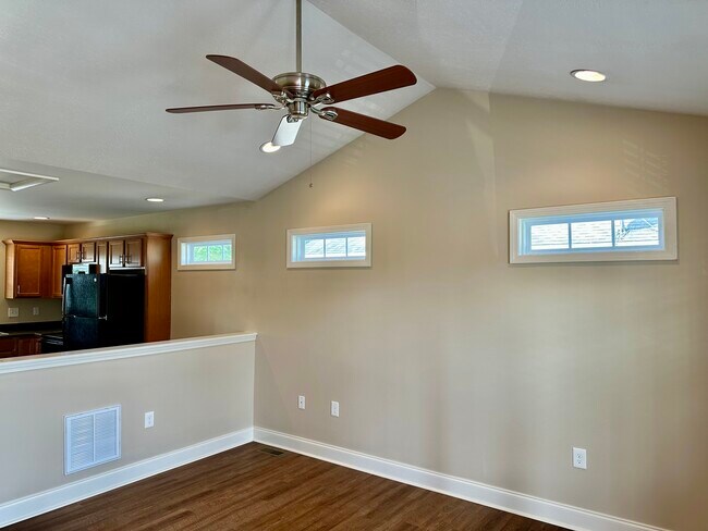 Great room opens to kitchen highlighted by triple transoms - 2312-B Belle Ave NE