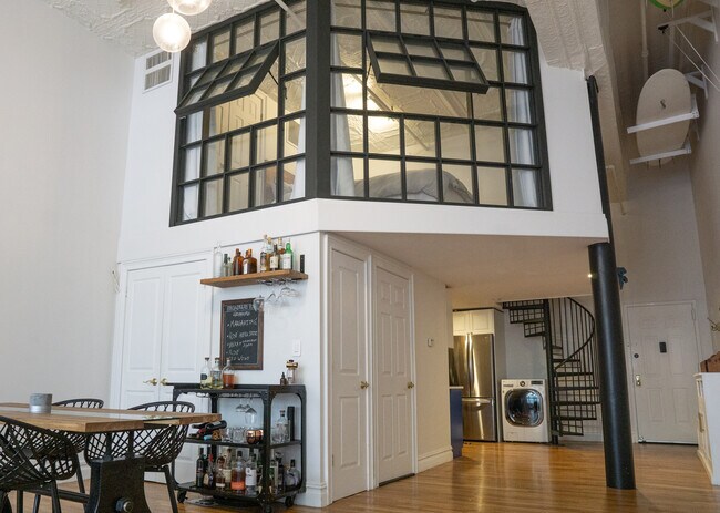 Photo from living room showing enclosed loft, hallway area, and main entrance - 25 N Broadway