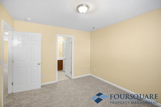 Building Photo - Charming 3-Bedroom Townhome with First-Floor Suite & Off-Street Parking – Near Capital Blvd & I-440