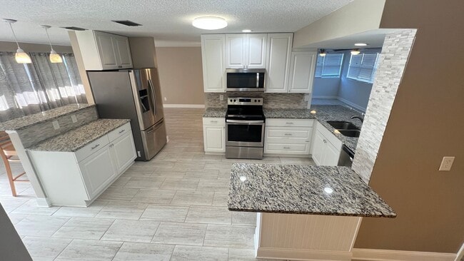 Building Photo - IMMACULATE 4 Bedroom, 2 Bathroom Home in Cocoa Beach!! ONLY MINUTES from the Beach!! (Lawn Care I...