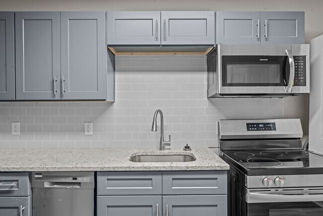 Building Photo - Experience Modern Living: Newly Renovated ...