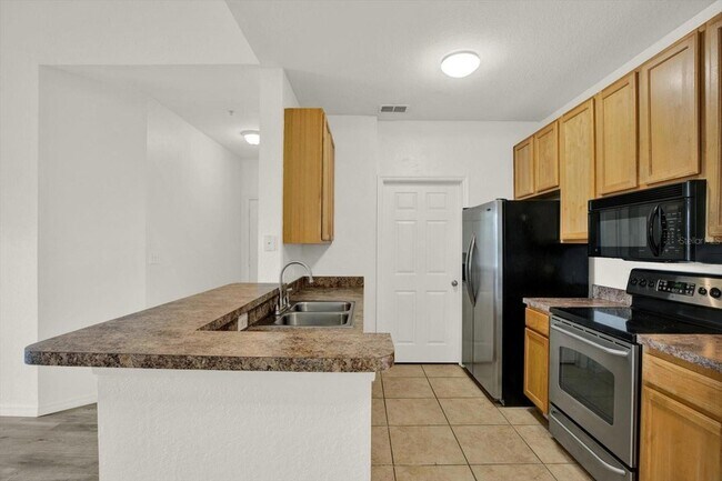 Building Photo - 10201 Courtney Palms Blvd