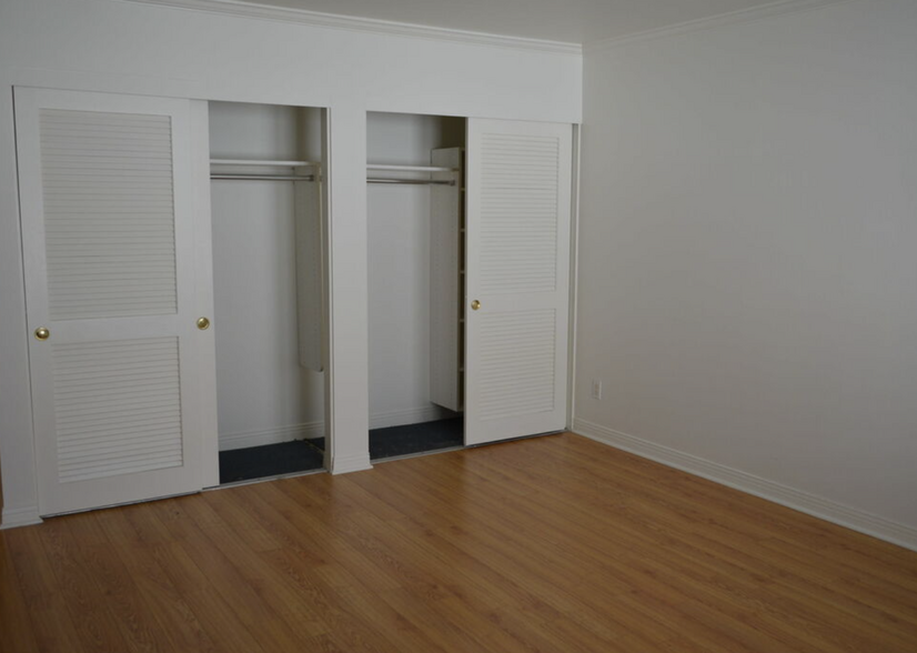 Primary Bedroom Closets (picture taken when unit was vacant) - 1144 Yale St