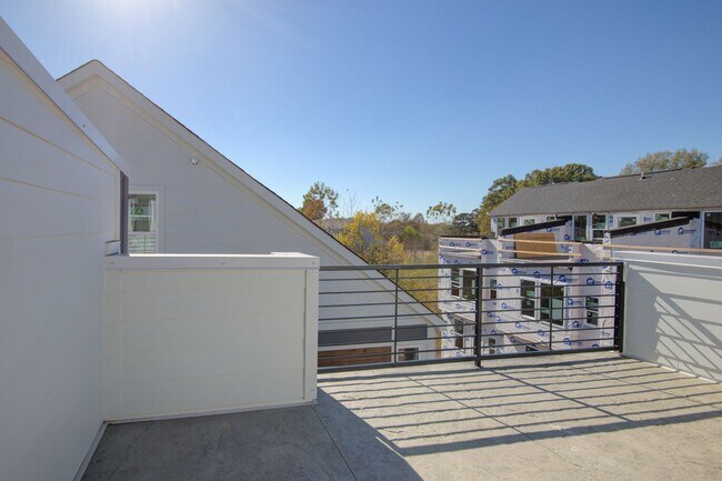 Building Photo - COMING SOON! Modern End-Unit Living Near Uptown | Rooftop Terrace + Tandem Garage