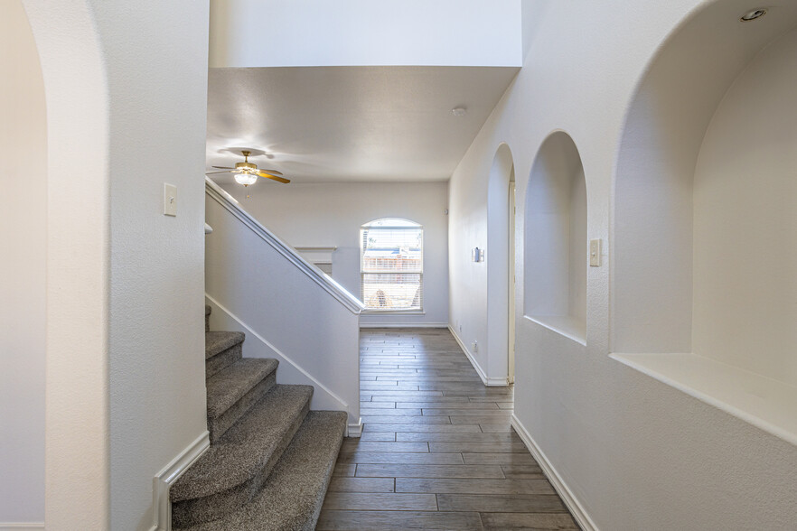 hallway going up. - 7318 Chimney Bluff