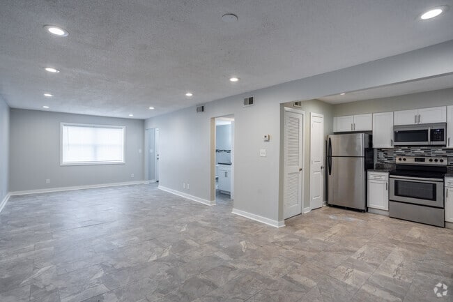 3BR, 1.5BA - 1,340SF - Living Room/Kitchen - Crystal Townhomes