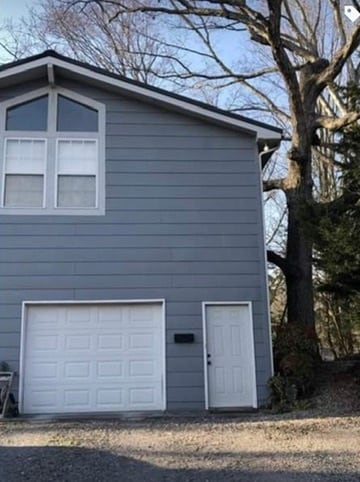 Front of House with entrance and garage - 8923 Path Way
