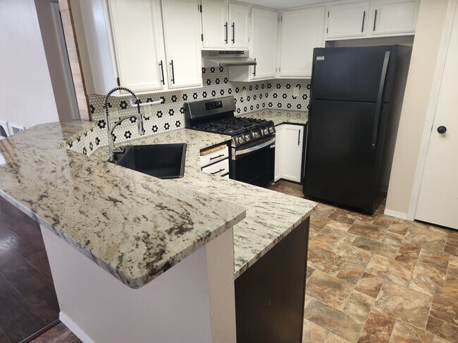 Building Photo - 3 Bedroom with large yard.
