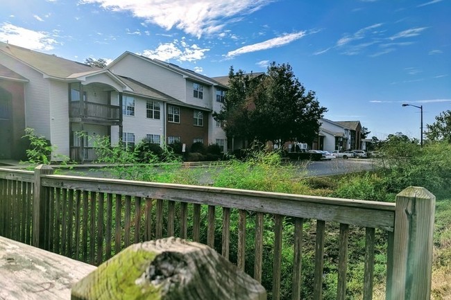 View of Property Over Bridge - Little Lott's Creek Apartments