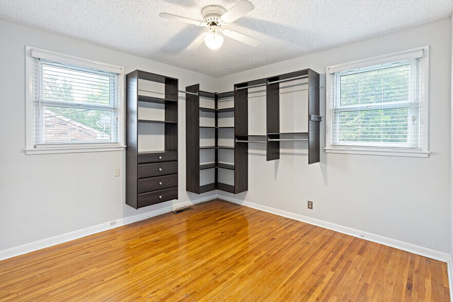 Bedroom 1 with built in storage as well as closet - 3841 Dubois Dr