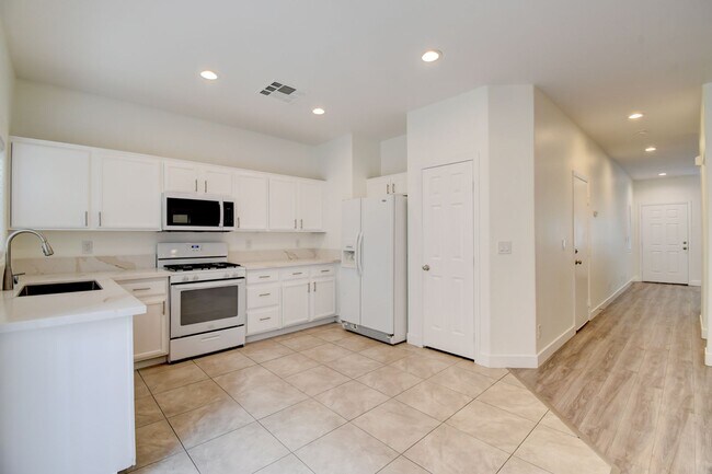 Building Photo - Great home with 4 bedrooms, 2.5 baths. New Floors Paint and Countertops.