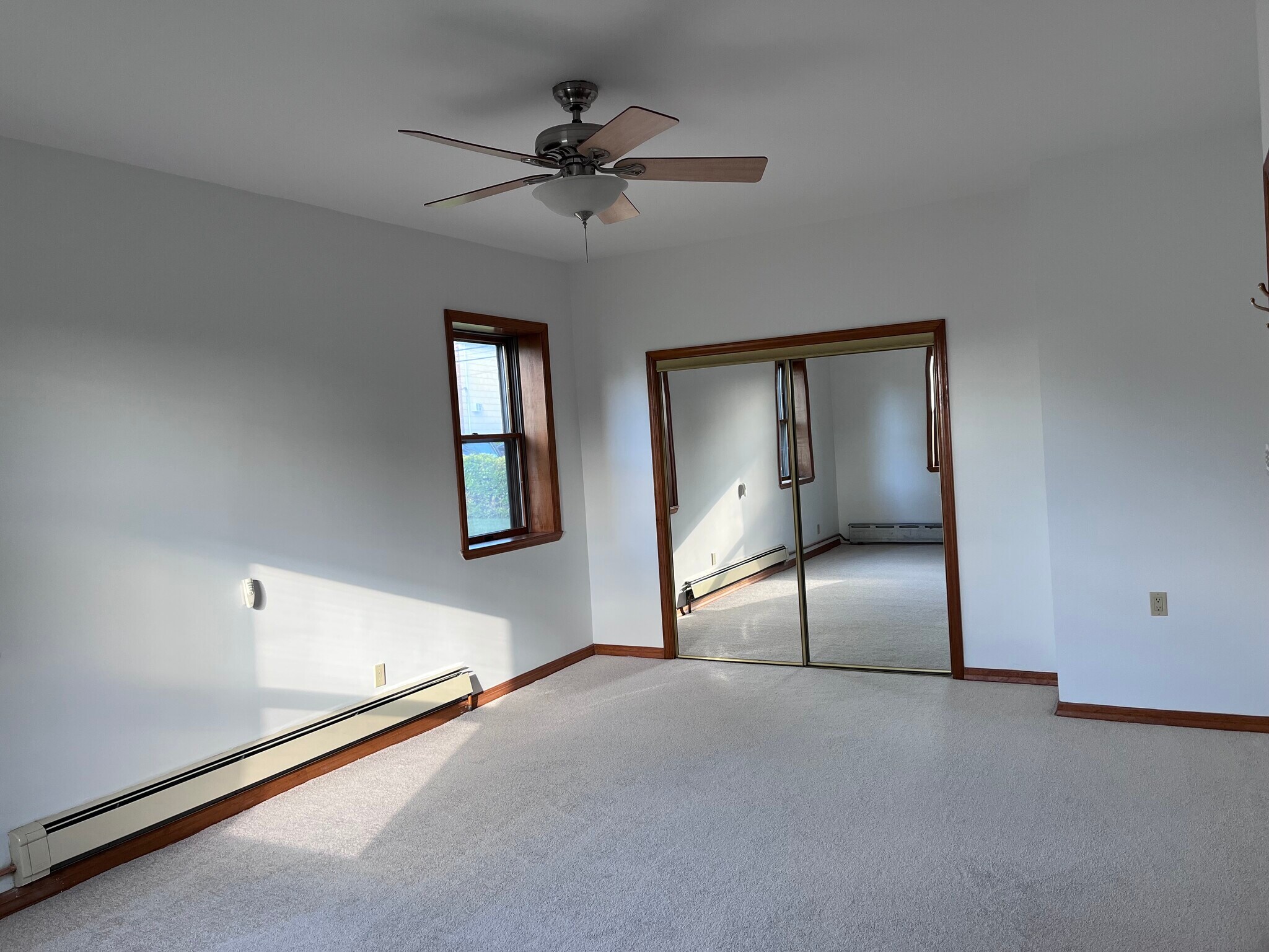 bedroom 1 on floor level with carpet and large closet space - 239 Kingston Ave
