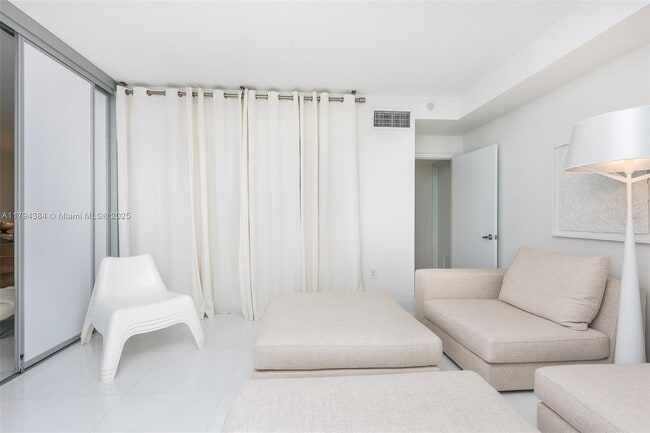 Building Photo - 10275 Collins Ave
