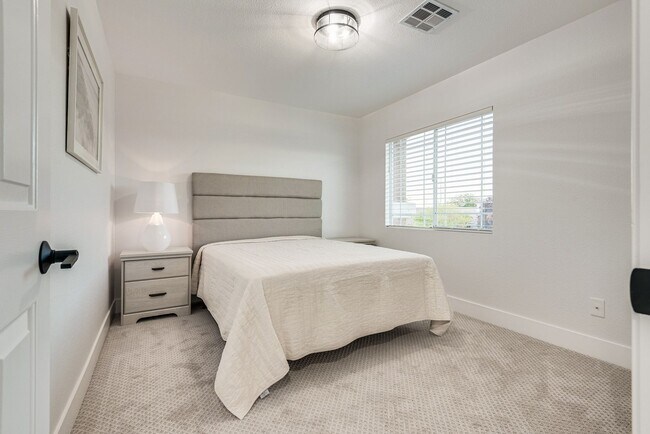 Building Photo - FULLY FURNISHED! Exudes sophistication with designer touches throughout