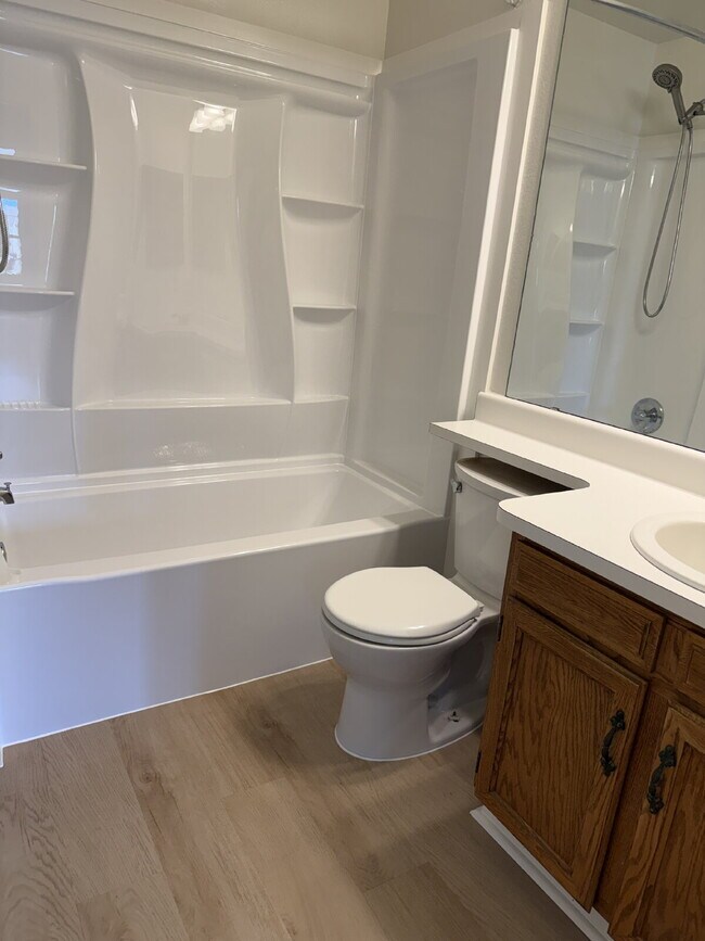 Building Photo - Cozy 2 Bed, 1.5 Bath Townhouse with Fireplace + Community Pool + Reserved Parking Space!