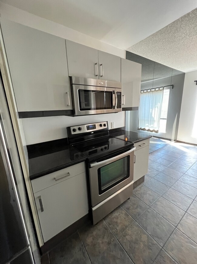 Kitchen to Dining - 7300 Franklin Ave